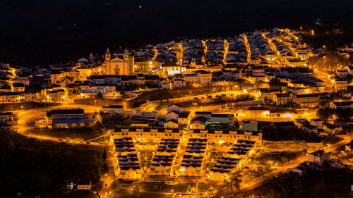 High angle view of illuminated cityscape at night