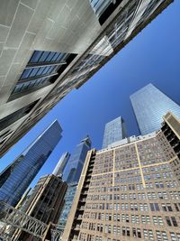 Low angle view of skyscrapers against sky
