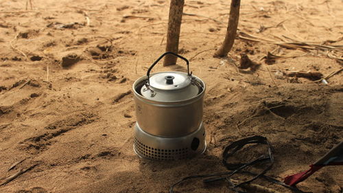 High angle view of kettle on sand