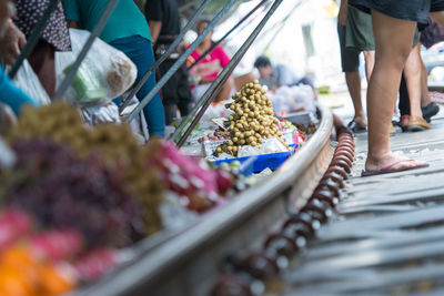 Low section of people standing on railroad track