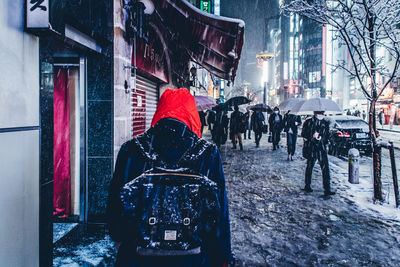 Rear view of man walking in city