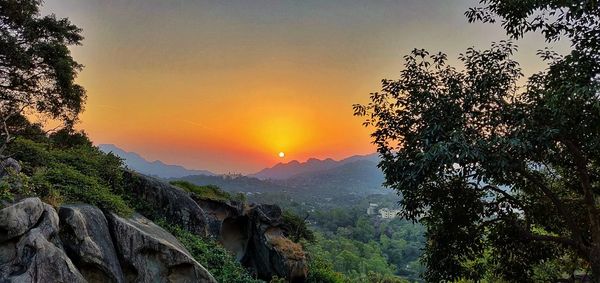 Scenic view of mountains against sky during sunset