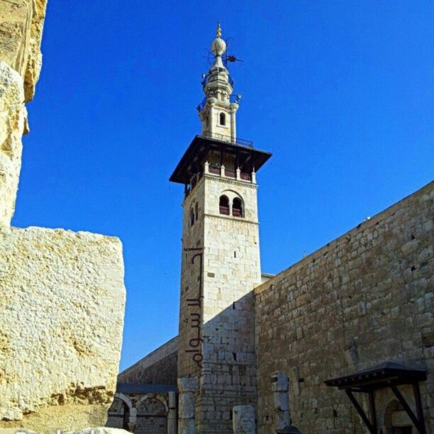 LOW ANGLE VIEW OF TEMPLE AGAINST CLEAR BLUE SKY