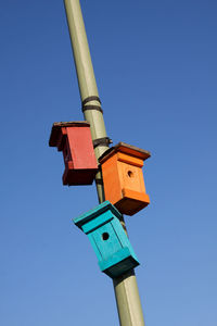 Low angle view of tower against clear blue sky