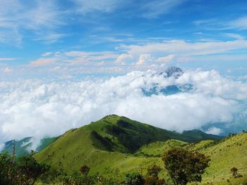 Scenic view of mountain landscape against cloudy sky