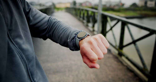 Midsection of man holding hands