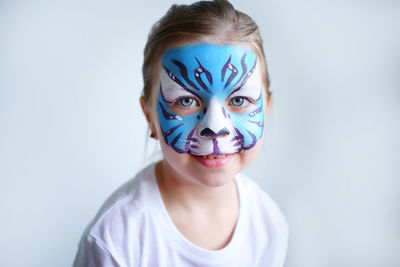 Girl aqua makeup in the form of a blue water tiger zodiac, symbol of the new year 2022.