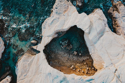 High angle view of rock formations in water