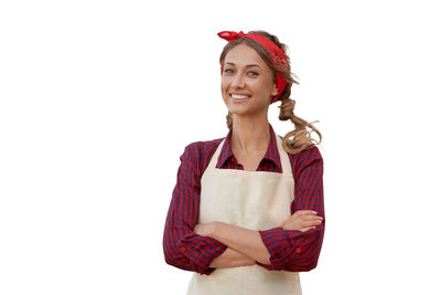 Portrait of a smiling young woman against white background