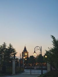 City against clear sky at sunset