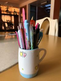 Close-up of coffee cup on table at home