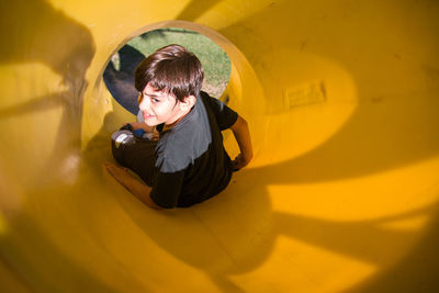 Child sliding in playground