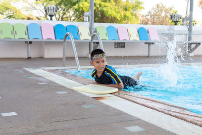 Full length of boy in swimming pool