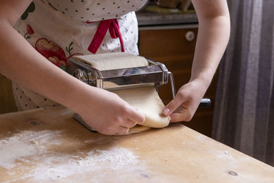 Midsection of woman washing hands