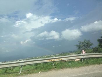 View of road against cloudy sky