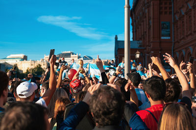 Group of people photographing in city