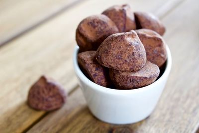 Close-up of fresh praline chocolates in bowl on table