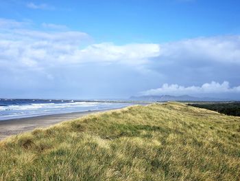 Scenic view of beach against sky