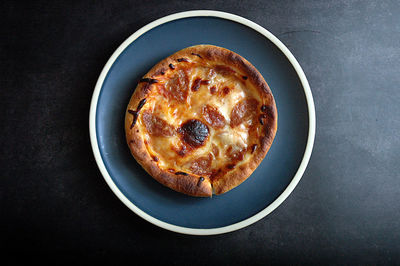 High angle view of mini pizza in plate on table