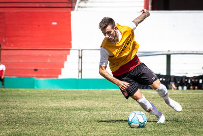 Man playing soccer on field