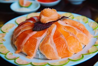 Close-up of orange slices in plate on table