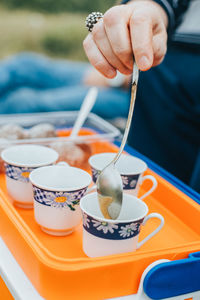 Close-up of hand holding ice cream