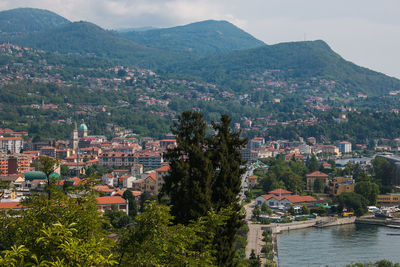 High angle view of townscape and mountains against sky