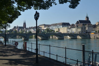 View of bridge over river in city