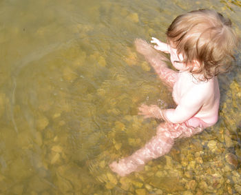 High angle view of girl swimming in pool