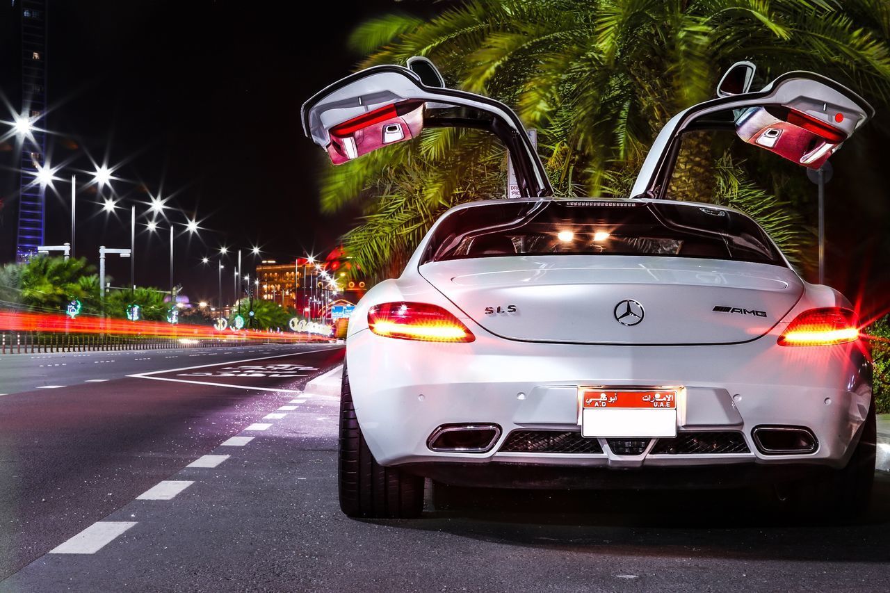 CAR ON ROAD AT NIGHT