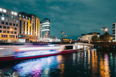 Illuminated buildings in city at night