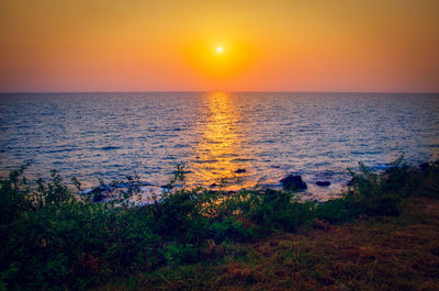 Scenic view of sea against sky during sunset