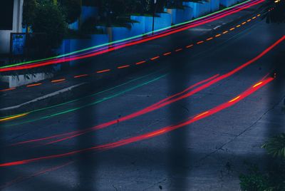 High angle view of light trails on road