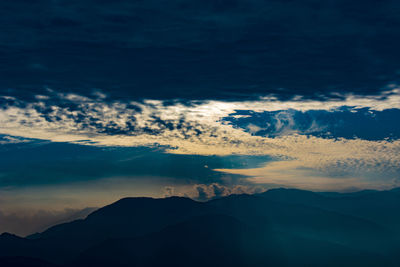 Scenic view of mountains against sky during sunset