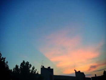Silhouette of built structure at sunset