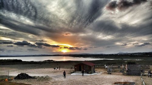 Scenic view of beach against sky during sunset