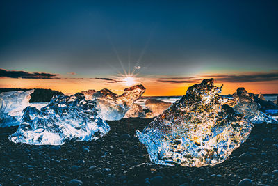 View of rock on snow covered land