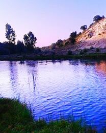 water, tranquil scene, lake, scenics, tranquility, reflection, beauty in nature, tree, clear sky, nature, blue, idyllic, sky, waterfront, calm, outdoors, sunset, rippled, no people, lakeshore