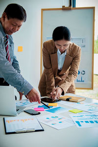 Two people working in office