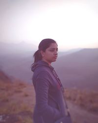 Portrait of woman on landscape during winter