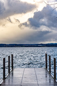 Pier on sea against sky