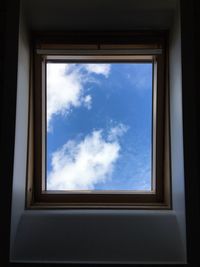 Low angle view of sky seen through window