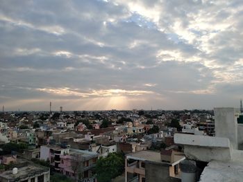 High angle view of townscape against sky at sunset