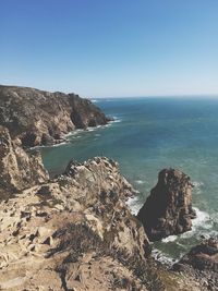 Scenic view of sea against clear blue sky