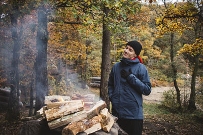 Man making campfire in forest