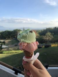 Hand holding ice cream cone