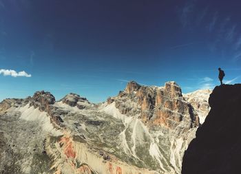 Scenic view of mountain against blue sky