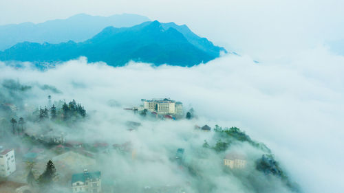 High angle view of buildings in city against sky