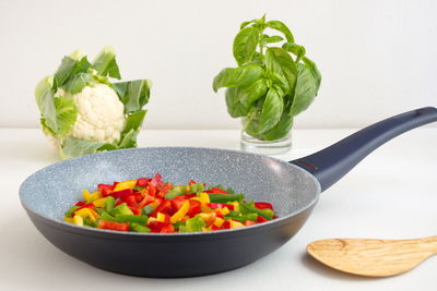 Close-up of chopped vegetables in bowl on table