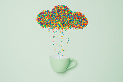 Close-up of multi colored candies against white background